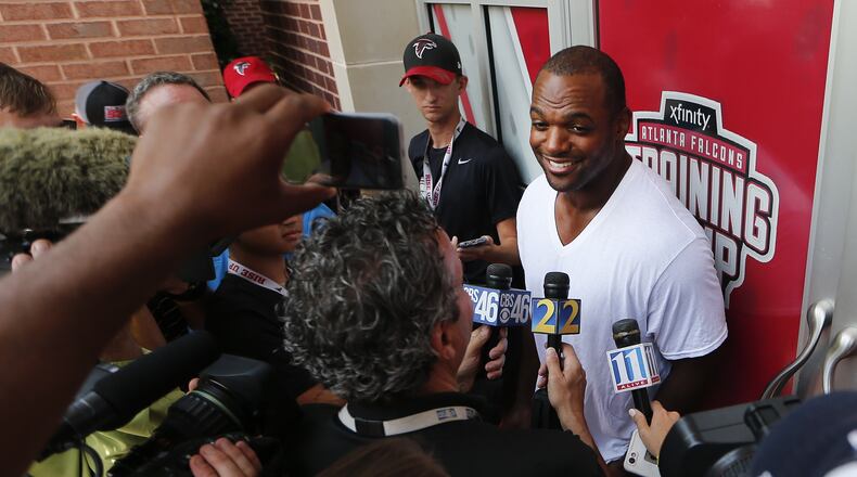 Newly acquired Atlanta Falcons defensive lineman Dwight Freeney talks to reporters as he reports for NFL football training camp Thursday, Aug. 4, 2016, in Flowery Branch, Ga. (AP Photo/John Bazemore)