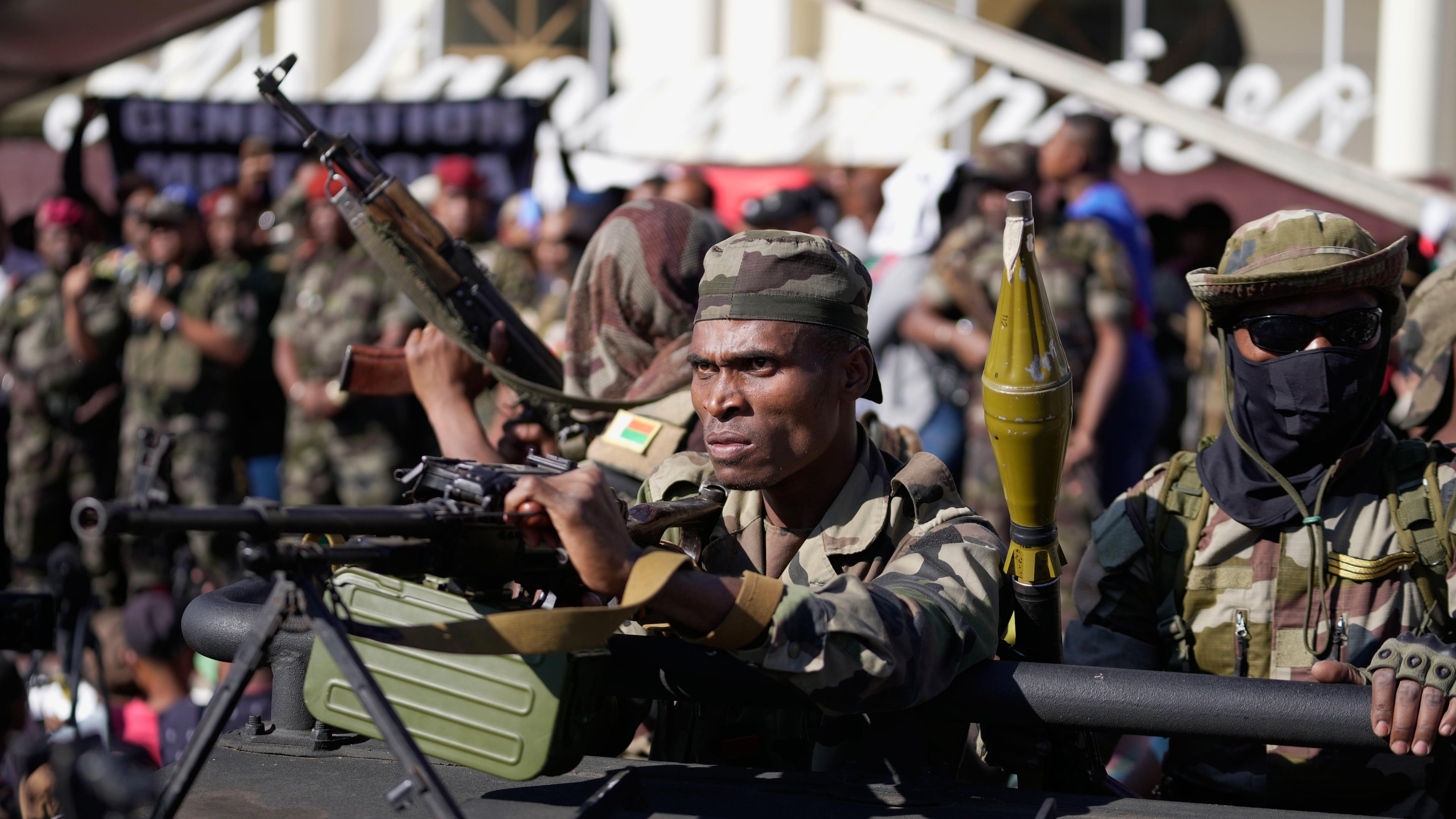 Troops loyal to CAPSAT military unit commander Col. Michael Randrianirina joins protesters to announce that the armed forces are taking control of the country in Antananarivo, Madagascar, Tuesday, Oct. 14, 2025. (AP Photo/Brian Inganga)
