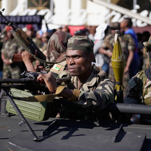 Troops loyal to CAPSAT military unit commander Col. Michael Randrianirina joins protesters to announce that the armed forces are taking control of the country in Antananarivo, Madagascar, Tuesday, Oct. 14, 2025. (AP Photo/Brian Inganga)