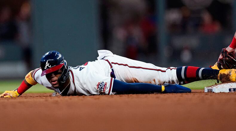 Ronald Acuna steals second base in the sixth inning of the team's baseball game against the St. Louis Cardinals on Thursday, June 17, 2021, in Atlanta.