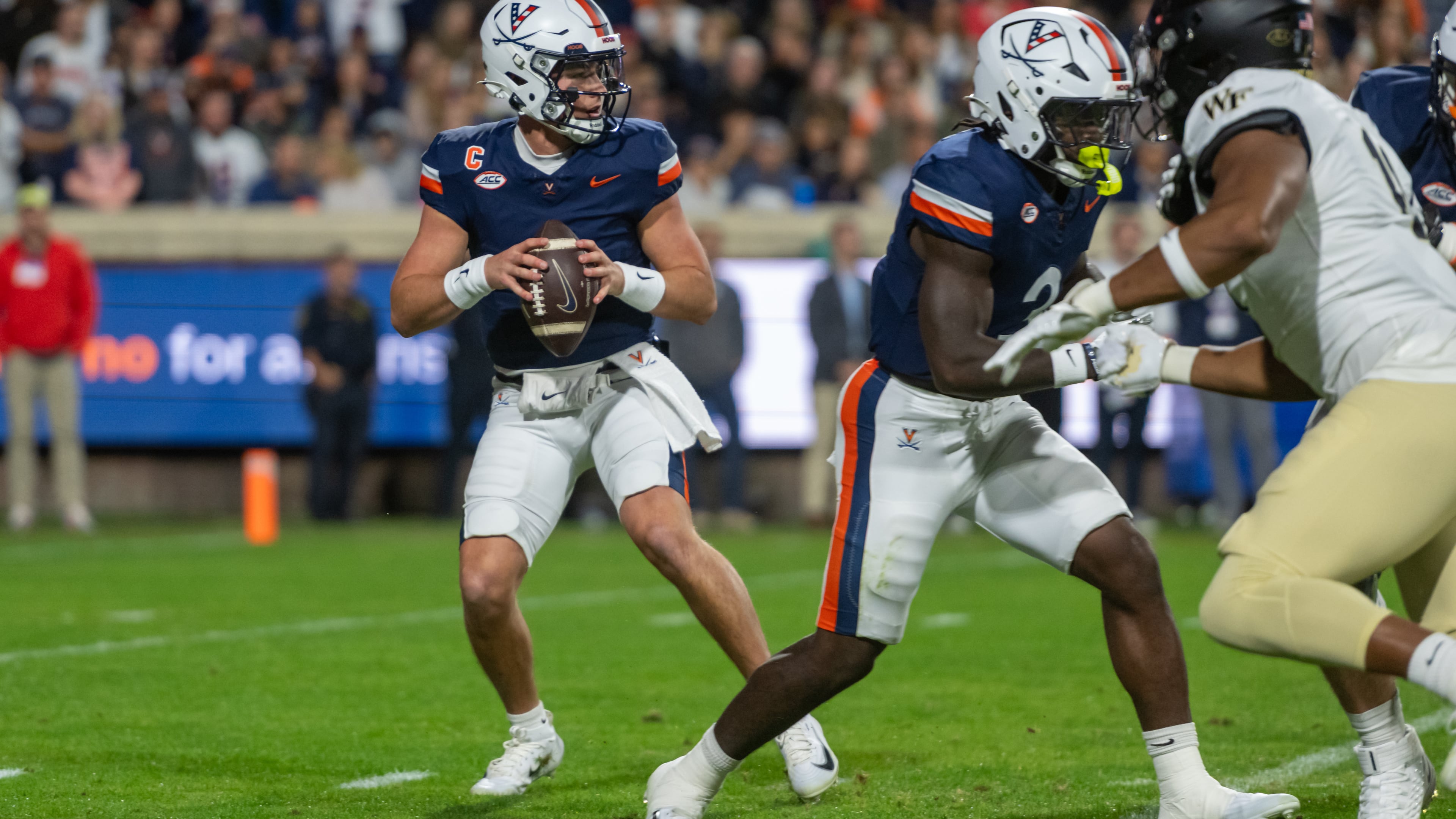 Virginia quarterback Chandler Morris (4) steps to pass against Wake Forest during the first half of an NCAA college football game, Saturday, Oct. 4, 2025, in Charlottesville, Va. (AP Photo/Robert Simmons)