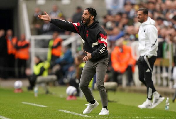 Manchester United's manager Ruben Amorim gestures during the English Premier League soccer match between Newcastle United and Manchester United in Newcastle upon Tyne, England, Sunday, April 13, 2025. (Owen Humphreys/PA via AP)