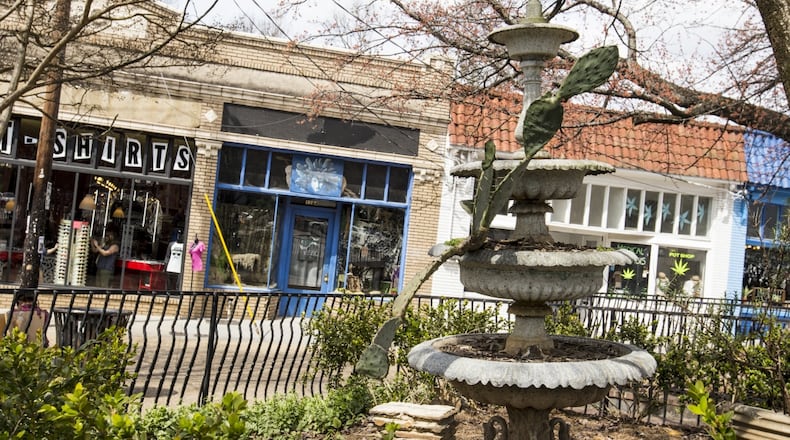 Findley Plaza is the center of Little 5 Points at the corner of Moreland and Euclid Avenues. Once a trolly car stop it is now a collection of small quirky gardens and a gathering spot for artists, homeless, tourists, students and locals. The plaza is surounded by shopping and resaurants. (Jenni Girtman / Atlanta Event Photography)
