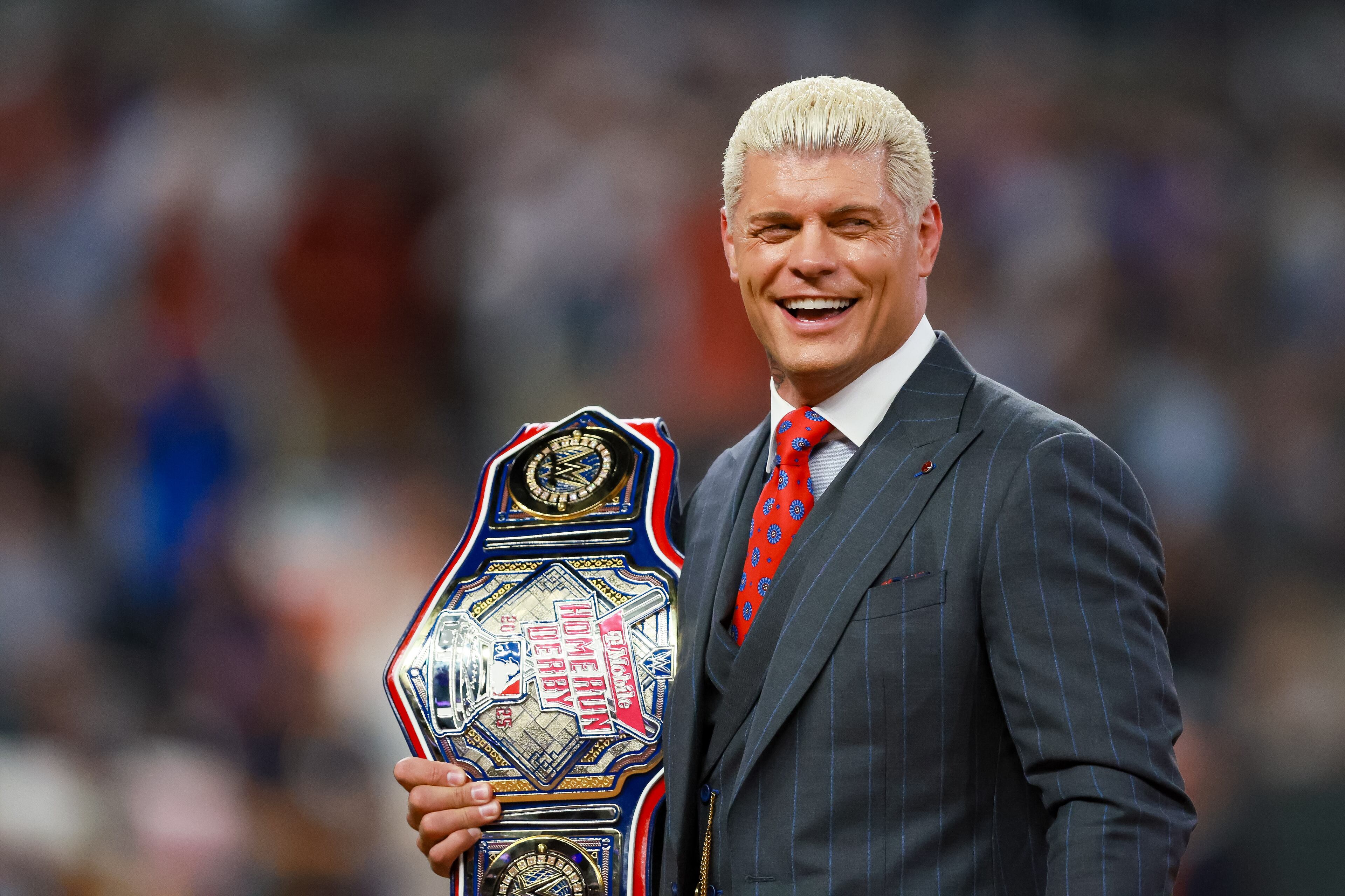 Wrestling champion Cody Rhodes presents the winning belt during the MLB Home Run Derby as part of the All-Star Game festivities on Monday, July 14, 2025 at Truist Park in Atlanta. Jason Getz / AJC