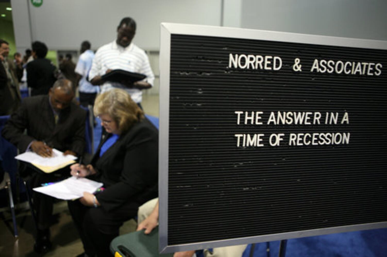 Job hunters line up at career fair