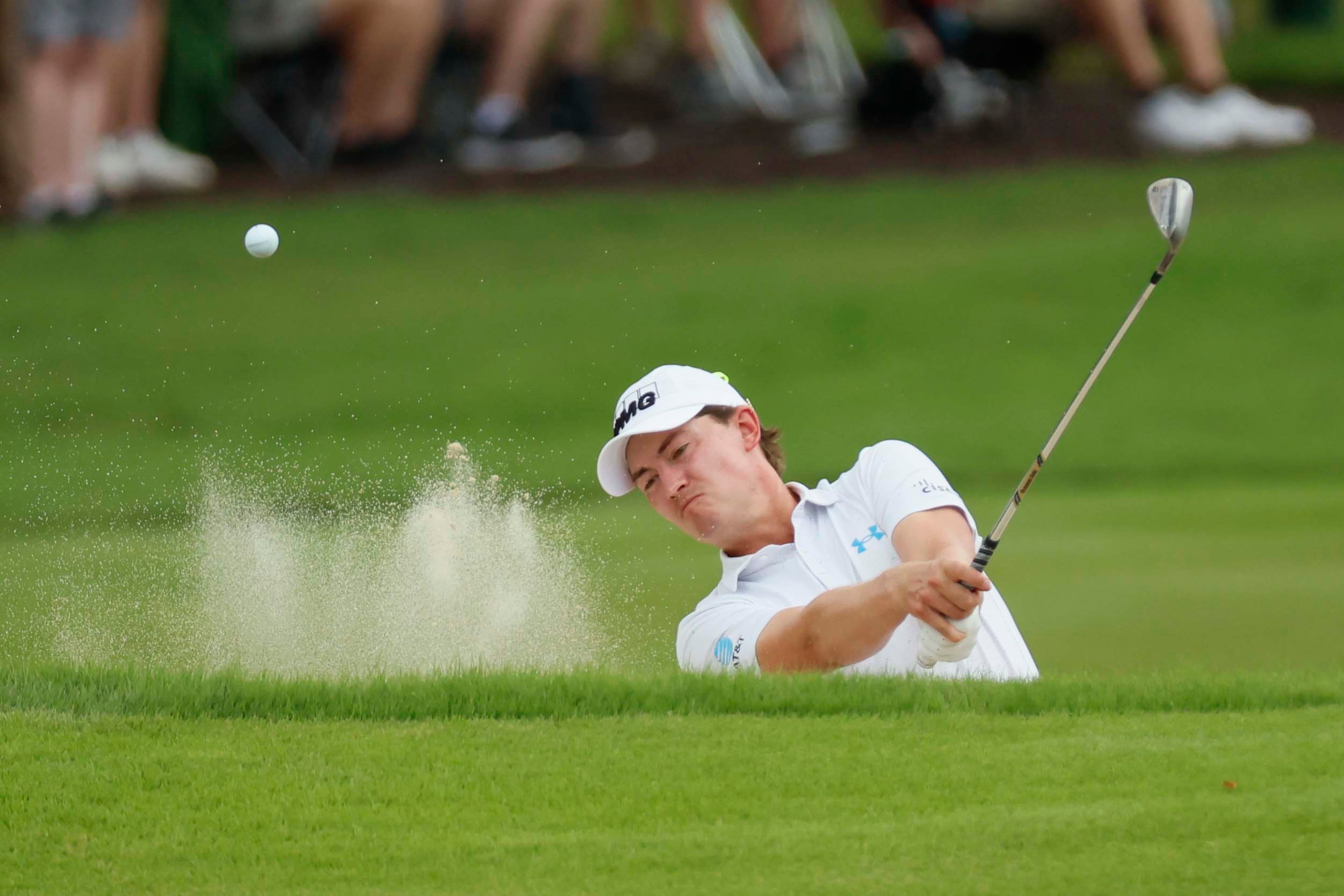 Maverick McNealy chips out of the bunker on the third hole during the final round of the PGA Tour Championship at East Lake Golf Club, on Sunday, Aug. 24, 2025, in Atlanta. (Miguel Martinez/ AJC)
