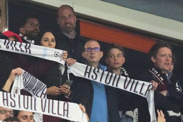 Britain's Prince William and Prince George attend the Champions League quarterfinal second leg soccer match between Aston Villa and Paris Saint-Germain at the Villa Park stadium, in Birmingham, England, Tuesday, April 15, 2025. (AP Photo/Frank Augstein)