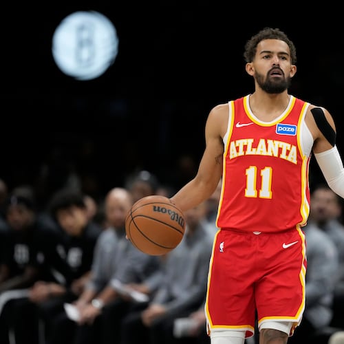 Atlanta Hawks' Trae Young (11) looks to pass during the first half of an NBA basketball game against the Brooklyn Nets Wednesday, Oct. 29, 2025, at Barclays Center in New York. (AP Photo/Frank Franklin II)