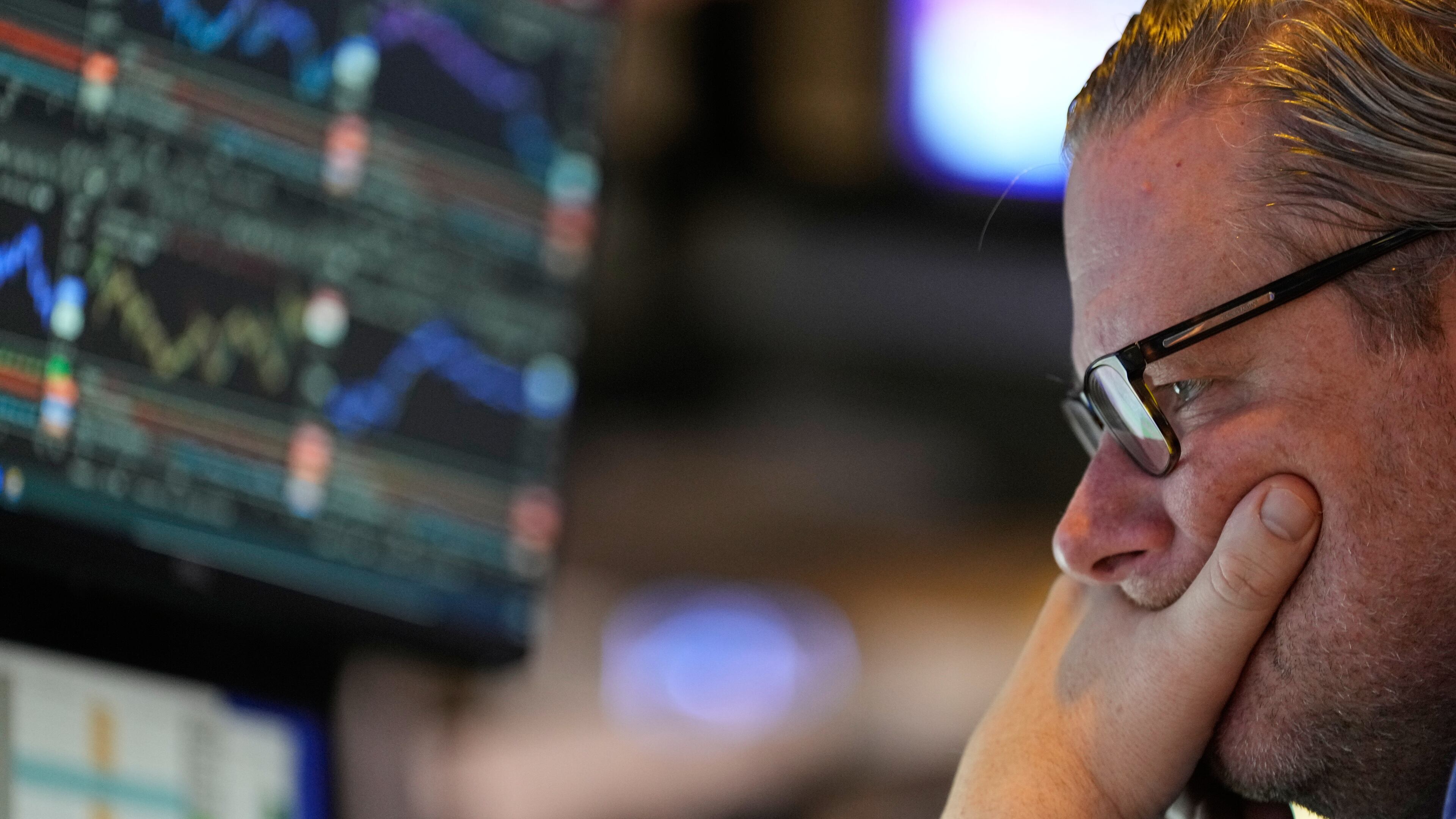 Gregg Maloney works on the floor at the New York Stock Exchange in New York, Wednesday, Dec. 10, 2025. (AP Photo/Seth Wenig)