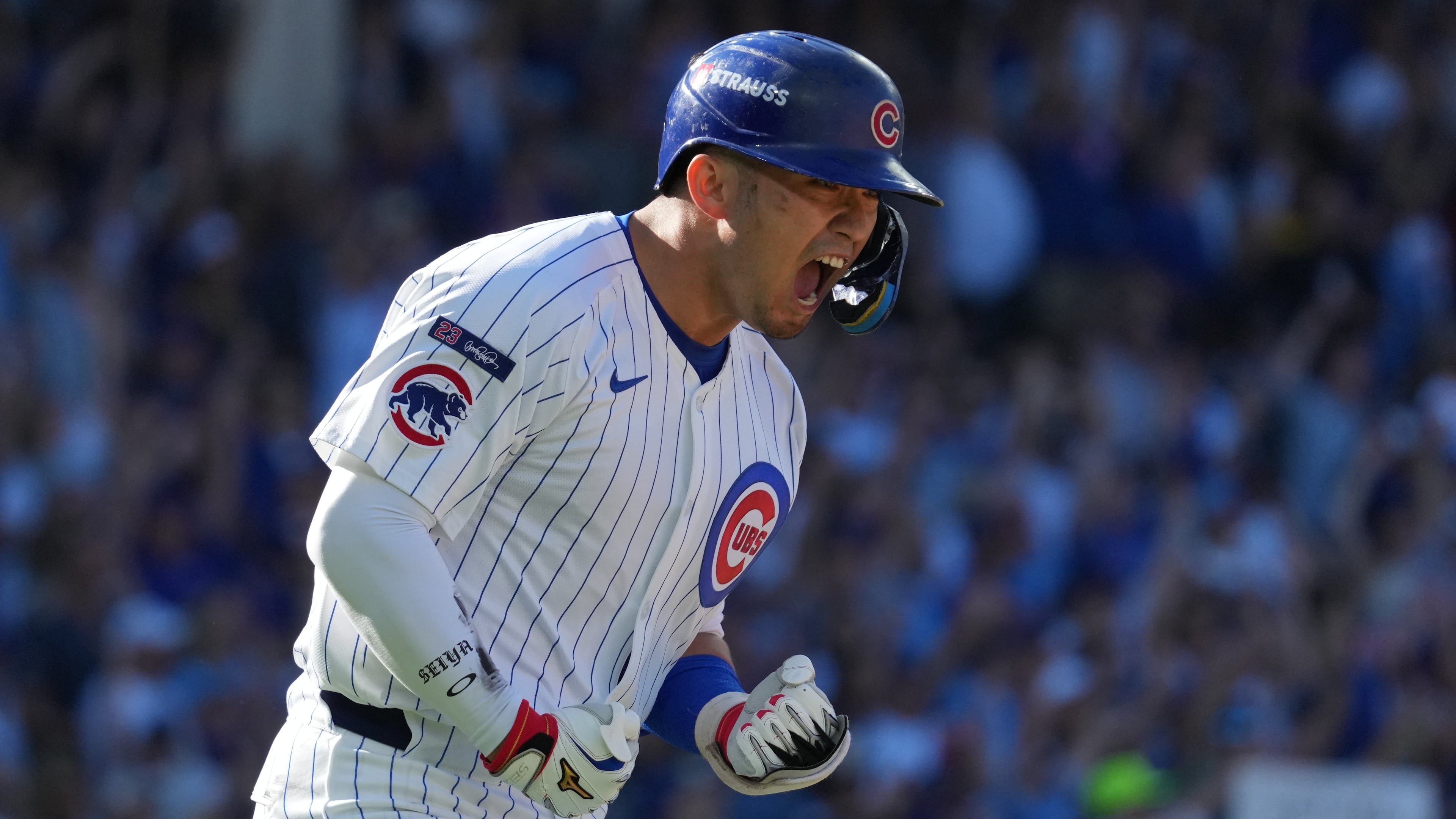 Chicago Cubs' Seiya Suzuki reacts after hitting a home run during the fifth inning of Game 1 of a National League wild card baseball game against the San Diego Padres Tuesday, Sept. 30, 2025, in Chicago. (AP Photo/Nam Huh)