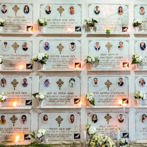 FILE - Candles are lit on a memorial wall during an anniversary service at the Holy Trinity Cathedral in Addis Ababa, Ethiopia, March 8, 2020, to remember those who died in the Ethiopian Airlines flight ET302 crash. (AP Photo/Mulugeta Ayene, File)