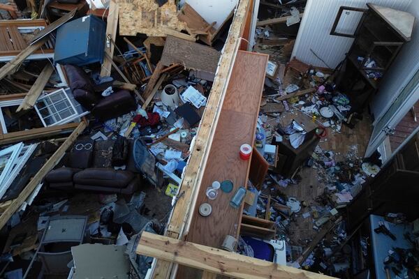 A destoryed home is seen from above after a severe storm passed through the area, Saturday, May 17, 2025, in London, Ky. (AP Photo/Carolyn Kaster)