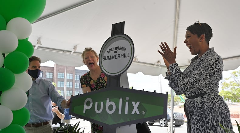 May 20, 2021 Atlanta - Mayor Keisha Lance Bottoms (right) and Councilwoman Carla Smith react as they announce during an unveiling event in Summerhill neighborhood on Thursday, May 20, 2021. Grocery chain Publix is slated to anchor the project's retail portion across Hank Aaron Drive from the former Turner Field. (Hyosub Shin / Hyosub.Shin@ajc.com)
