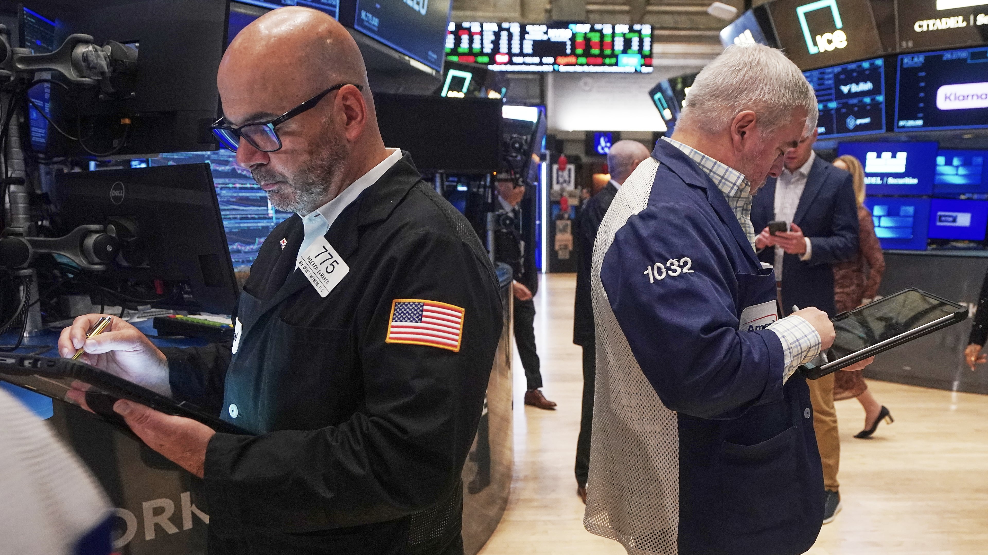 Traders Fred Demarco, left, and Edward McCarthy work on the floor of the New York Stock Exchange, Monday, Nov. 24, 2025. (AP Photo/Richard Drew)