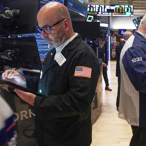 Traders Fred Demarco, left, and Edward McCarthy work on the floor of the New York Stock Exchange, Monday, Nov. 24, 2025. (AP Photo/Richard Drew)