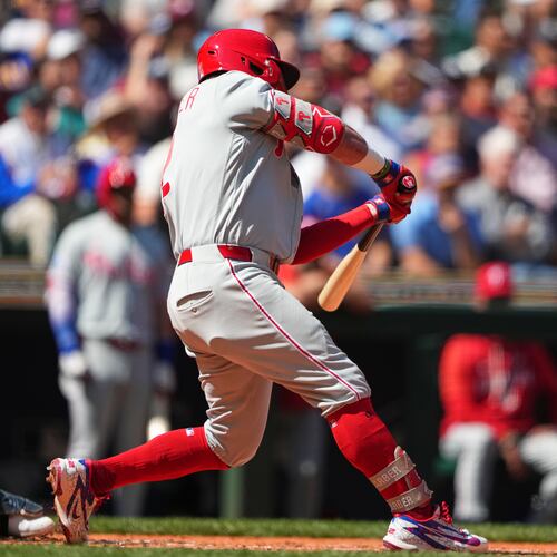 Philadelphia Phillies' Kyle Schwarber hits a three-run home run against Seattle Mariners starting pitcher Bryan Woo during the second inning of a baseball game, Wednesday, Aug. 26, 2026, in Seattle. (AP Photo/Lindsey Wasson)