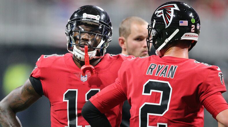 Falcons Julio Jones and Matt Ryan confer during the second half against the Saints in a NFL football game on Thursday, December 7, 2017, in Atlanta. Curtis Compton/ccompton@ajc.com