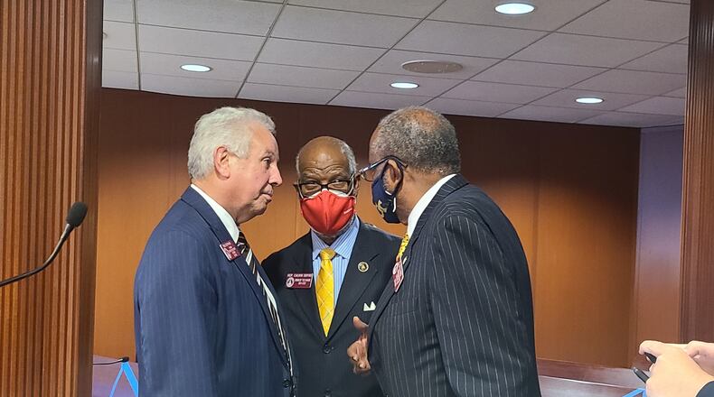 House Tourism and Economic Development Chairman Ron Stephens, R-Savannah, (left) speaks with Democratic lawmakers Tuesday after his legislation allowing online sports betting in Georgia was approved by a House committee. Maya T. Prabhu/maya.prabhu@ajc.com