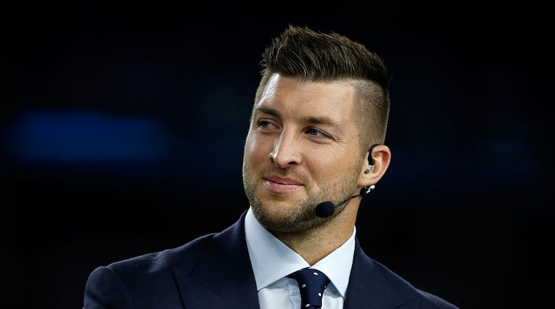 Broadcaster Tim Tebow of the SEC Network speaks on air before the Goodyear Cotton Bowl at AT&T Stadium on December 31, 2015 in Arlington, Texas. (Photo by Scott Halleran/Getty Images)