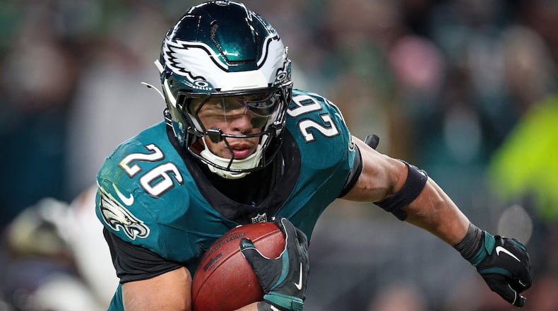 Eagles running back Saquon Barkley looks towards the end zone on his way to a touchdown against the Washington Commanders during the NFC championship game. (David Maialetti/The Philadelphia Inquirer/TNS)