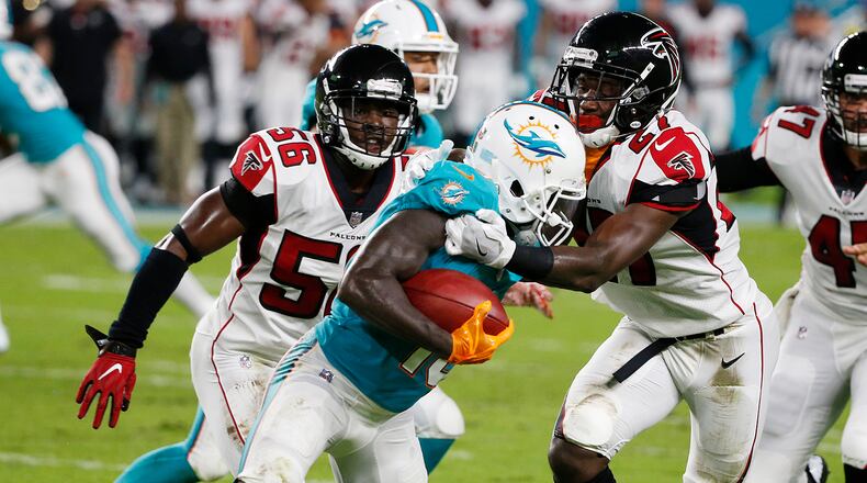 Atlanta Falcons cornerback Damontae Kazee (27) tackles Miami Dolphins wide receiver Jakeem Grant (19), during the first half of an NFL preseason football game, Thursday, Aug. 10, 2017, in Miami Gardens, Fla. (AP Photo/Wilfredo Lee)