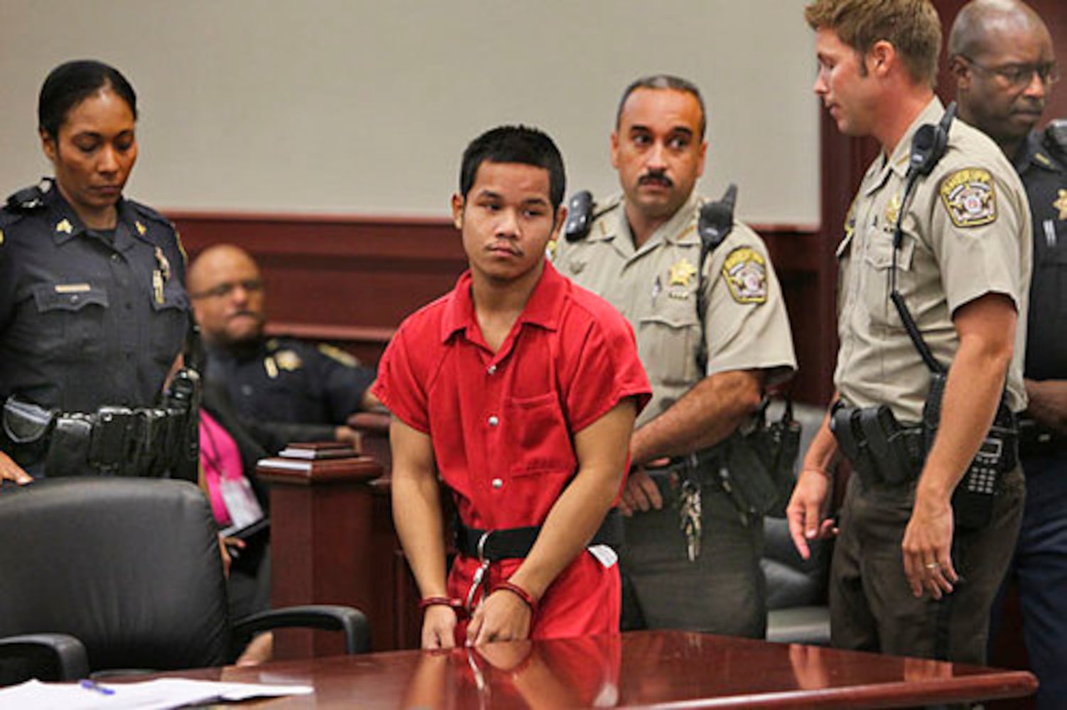 Teen in court, accused of killing cop