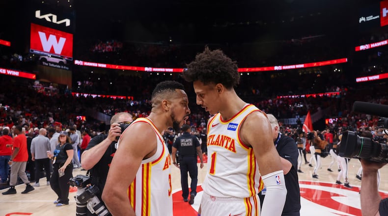 Hawks guard CJ McCollum (left) and forward Jalen Johnson celebrate the Game 3 win over the Knicks in the first round of the playoffs April 23, 2026, in Atlanta. The Hawks lost the series in six games. (Jason Getz/AJC)