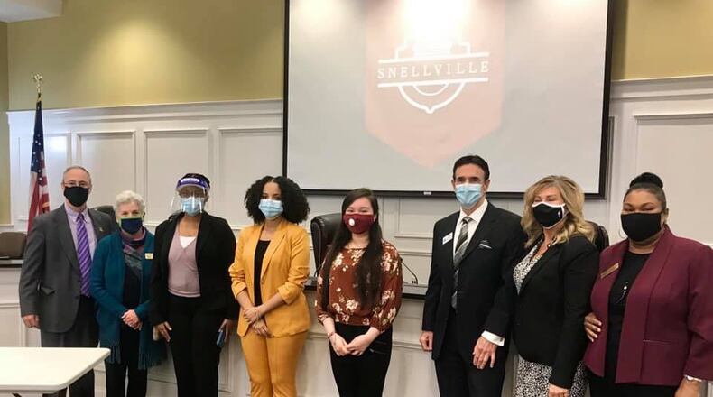 From left are Snellville Councilman Tod Warner, Councilwoman Gretchen Schulz, Ruth Lonse and Jasmine Kline of Shiloh High School, Angie Zaraza of South Gwinnett High School, Mayor Pro Tem Dave Emanuel, Councilwoman and SYC creator Cristy Lenski and Councilwoman Solange Destang. (Courtesy City of Snellville)