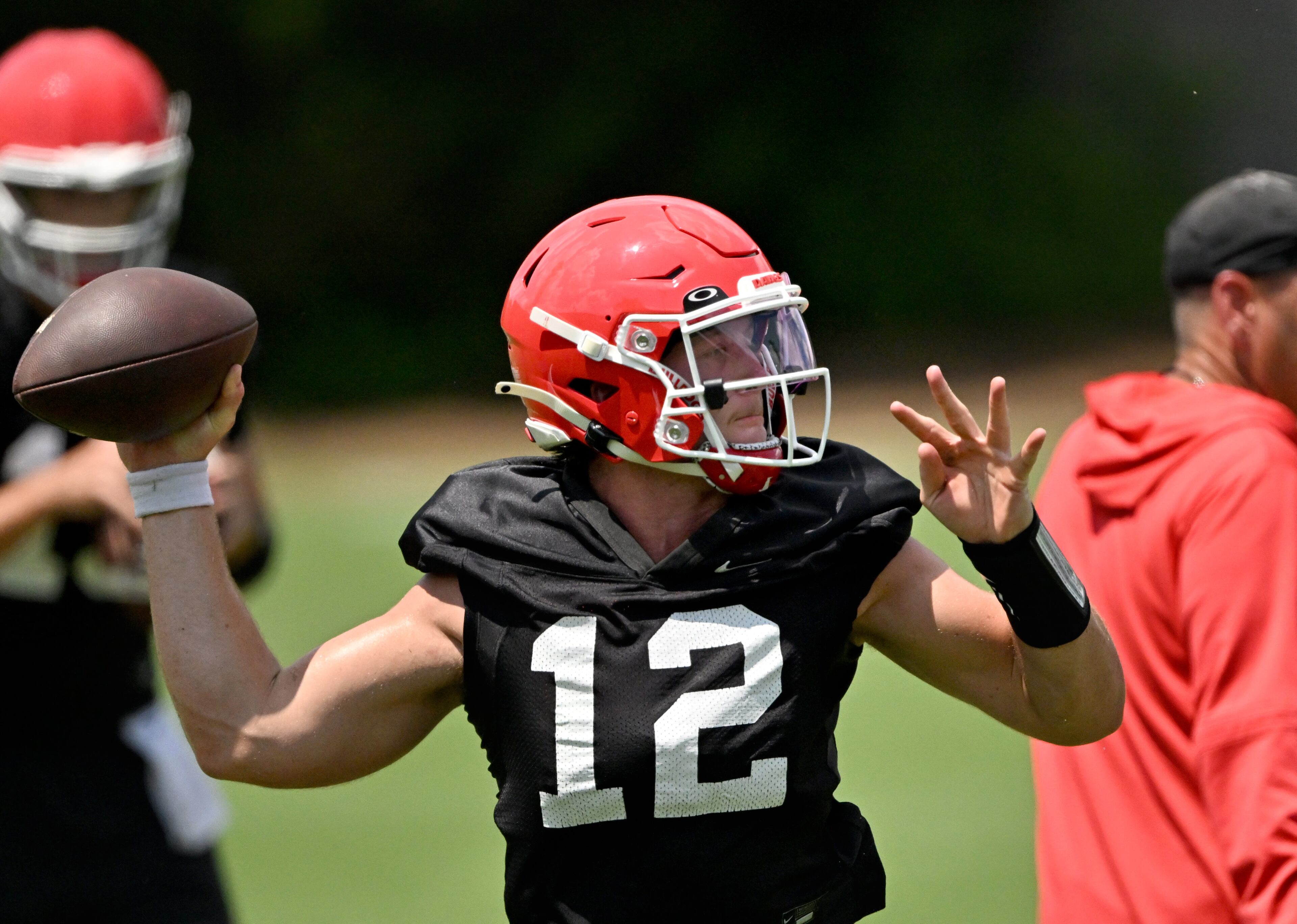 Georgia quarterback Ryan Puglisi (12) runs a drill during a football practice at the University of Georgia practice facility, Thursday, July 31, 2025, in Athens. (Hyosub Shin / AJC)