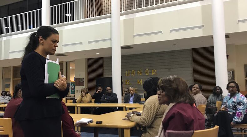 Atlanta Public Schools superintendent Meria Carstarphen, left, speaks to parents and community members during a meeting Monday at Mays High School. Photo by Vanessa McCray/AJC