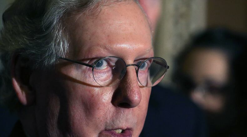 Mitch McConnell could pull a Harry Reid if Senate Democrats push too hard against President Trump's Supreme Court nominee. (Mark Wilson / Getty Images)