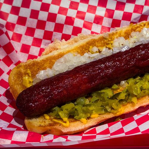 The Southsider, a 1/3-pound Vienna beef hot dog with onions, diced pickles and mustard at NFA Burger. (Henri Hollis /AJC)