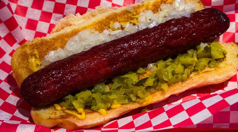 The Southsider, a 1/3-pound Vienna beef hot dog with onions, diced pickles and mustard at NFA Burger. (Henri Hollis /AJC)