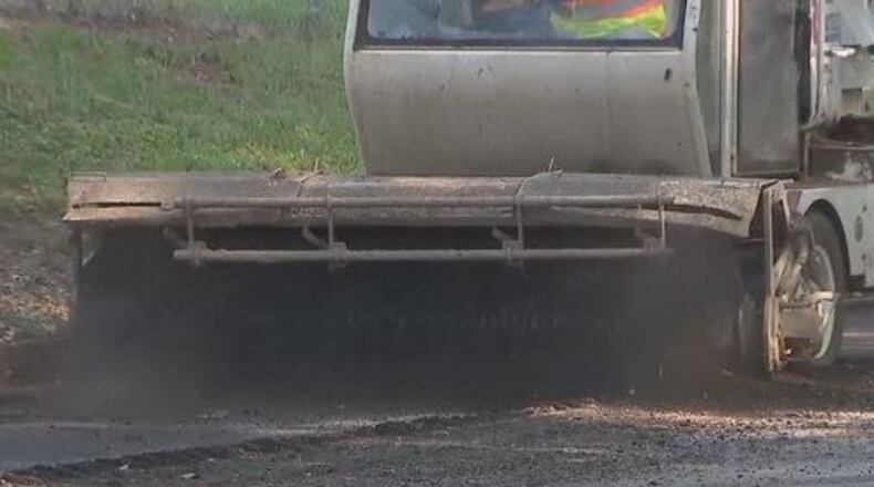 DeKalb County crews work on road resurfacing. CONTRIBUTED