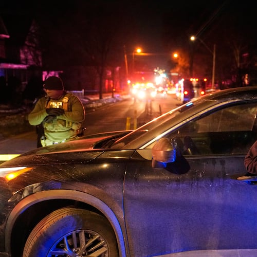 FILE - Federal immigration officers at the scene of a reported shooting Wednesday, Jan. 14, 2026, in Minneapolis. (AP Photo/John Locher, File)
