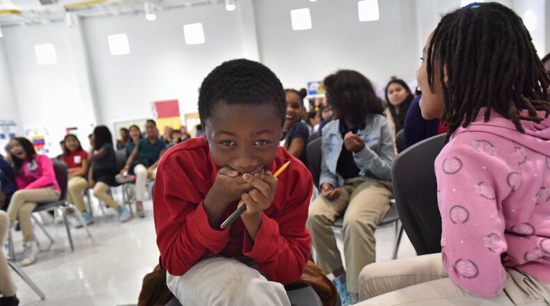 Jacob Arnold, 10, reacts as he learns he will be getting a laptop as part of Internet Essentials program during Internet Essentials Back to School Event at Morrow Middle School on Wednesday, October 4, 2017. HYOSUB SHIN / HSHIN@AJC.COM