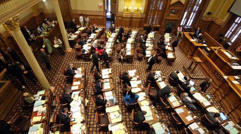 The Senate floor is busy just before Senators break for dinner during the day long Crossover Day at the State Capitol Wednesday afternoon in Atlanta, Ga., March 7, 2012. Expect legislators in 2014 to resume infighting over Common Core, the voluntary set of reading and math standards that has become a divisive issue in state politics. Critics worry the guidelines, a target of tea-party infused opposition, are a federal takeover of education policy.