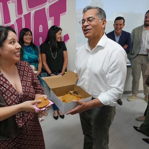 California Democratic gubernatorial candidate Xavier Becerra thanks Amy Perez for her support as he passes out cookies at the Planned Parenthood headquarters in Sacramento, Calif., Monday, June 1, 2026. (AP Photo/Rich Pedroncelli)