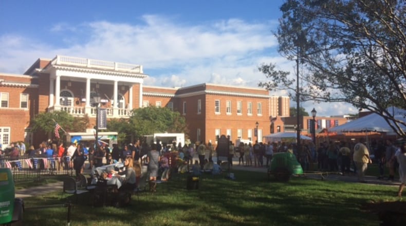 Students, professors and other Farmville locals celebrate the vice presidential debate at a festival on Longwood University's quad. Tamar Hallerman/AJC