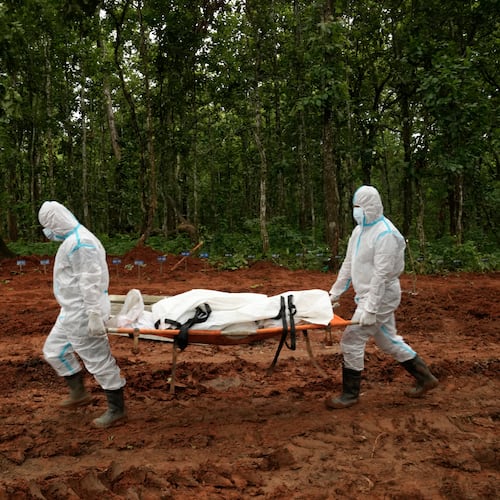 Nepal's paramilitary force personnel carry the body of a flash flood victim for burial at a mass burial site in Chitwan, Nepal, Monday, Aug. 31, 2026. (AP Photo/Dar Yasin)