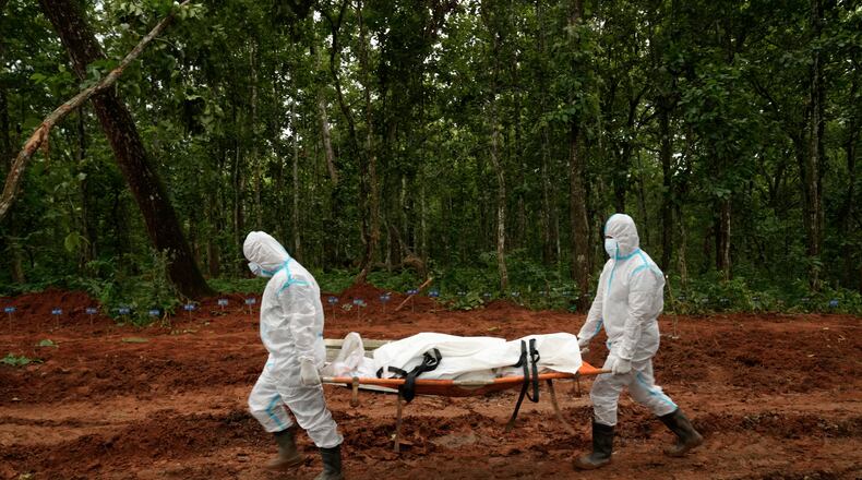 Nepal's paramilitary force personnel carry the body of a flash flood victim for burial at a mass burial site in Chitwan, Nepal, Monday, Aug. 31, 2026. (AP Photo/Dar Yasin)