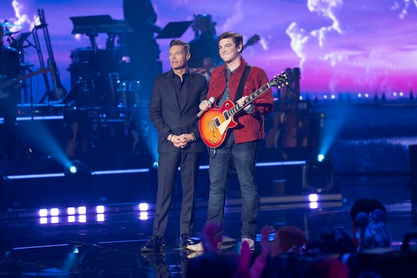 Fellow Atlanta native and host Ryan Seacrest joins Slater Nalley on the "Idol" stage Monday. (Christopher Willard/Disney)