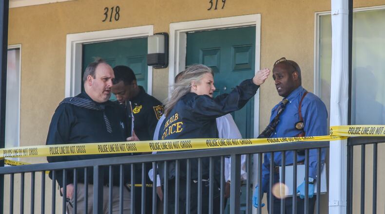 DeKalb County police homicide investigators investigate a death at the United Inn and Suites on Memorial Drive on April 19, 2018. The hotel is among 12 in DeKalb that received a combined 2,397 code enforcement citiations in 2018. JOHN SPINK/JSPINK@AJC.COM
