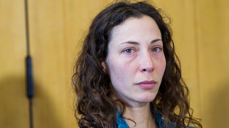 Czech tourist Pavlina Pizova attends a press conference at a police station in Queenstown, New Zealand, Friday, Aug. 26, 2016. Pizova, whose partner fell to his death, survived a harrowing month in the frozen New Zealand wilderness before being rescued, police said. (James Allan/New Zealand Herald via AP)