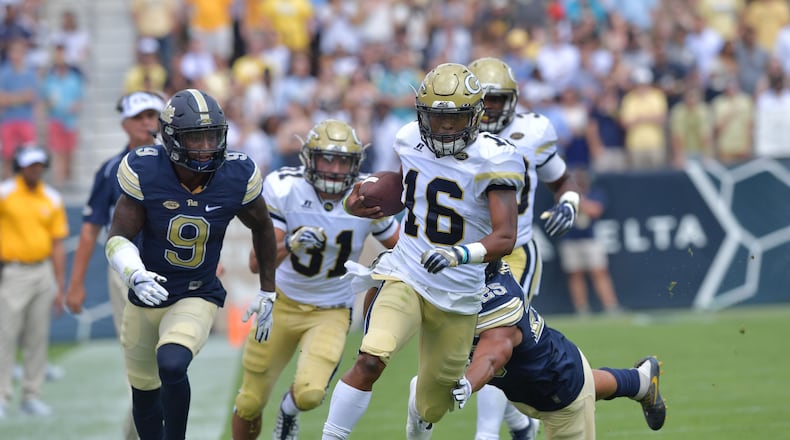 Georgia Tech quarterback TaQuon Marshall runs for a touchdown in the first quarter of Saturday's game against Pitt at Bobby Dodd Stadium. (Hyosub Shin/hshin@ajc.com)