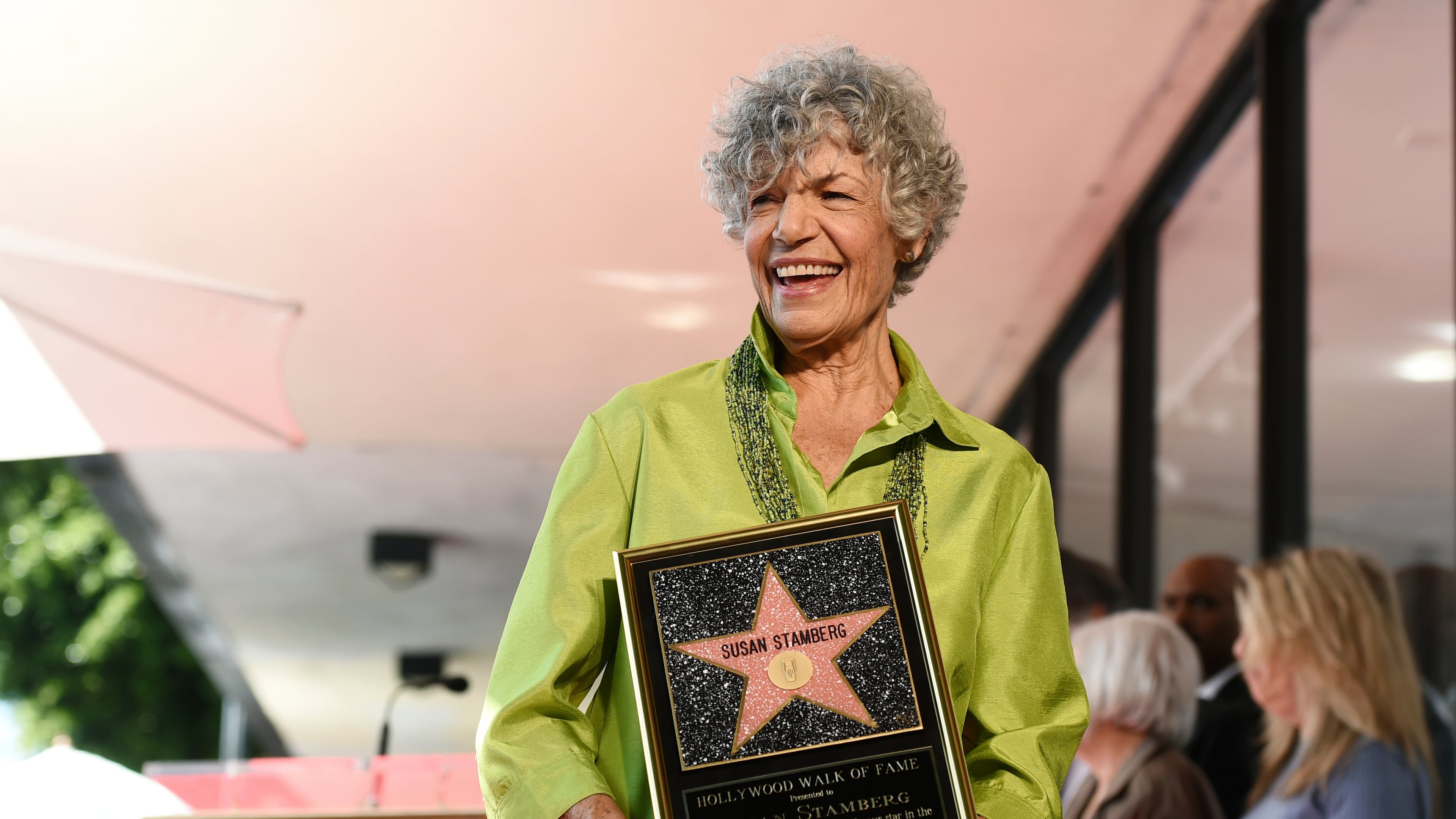 FILE - National Public Radio broadcast journalist Susan Stamberg holds up a replica of her new star on the Hollywood Walk of Fame following a ceremony, in Los Angeles, March 3, 2020. Stamberg, a ‘founding mother’ of NPR and the first female broadcaster to host a national news program, died Thursday, Oct. 16, 2025. She was 87. (AP Photo/Chris Pizzello, File)