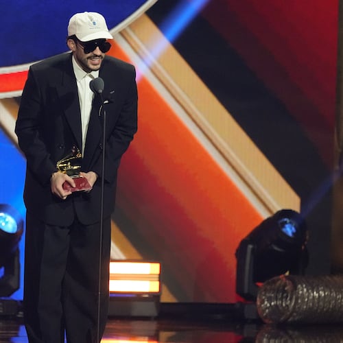 Bad Bunny accepts the award for best urban music album for "DeBí TiRAR MáS FOToS" during the 2025 Latin Grammys on Thursday, Nov. 13, 2025, at MGM Grand in Las Vegas. (AP Photo/Chris Pizzello)