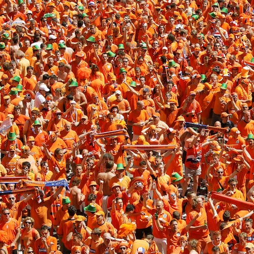 FILE - Dutch fans celebrate in preparation for the first match of their team at the special Dutch fan party area in Leipzig, eastern Germany, June 11, 2006. (AP Photo/Eckehard Schulz, File)