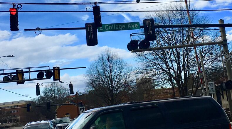 Decatur’s roughly 50 intersections are scheduled to get new traffic lights sometime next year. One change includes lights hanging on a single arm attached to an off-road pole instead of dangling from cables, as shown here. Bill Banks for the AJC