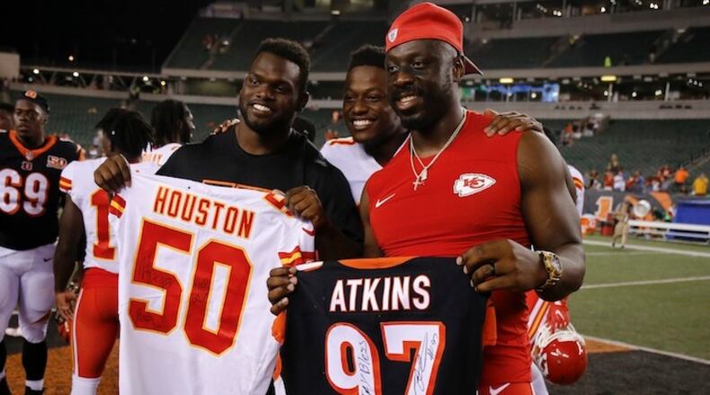 Cincinnati Bengals defensive tackle Geno Atkins, left, and Kansas City Chiefs outside linebacker Justin Houston, right, in the second half of an NFL preseason football game, Saturday, Aug. 19, 2017, in Cincinnati. The Chiefs won 30-12. (AP Photo/Gary Landers)